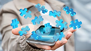 Businessman holding flying puzzle pieces Ã¢â¬Ë3D renderingÃ¢â¬â¢